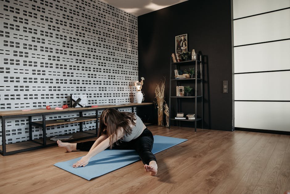 Woman posting a habit chart on her kitchen wall at sunrise, mat ready on the floor.
