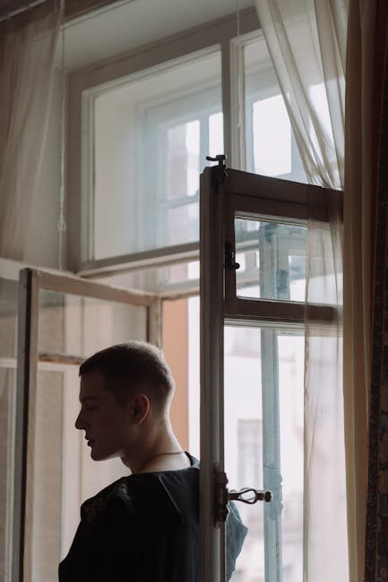 Man staging a kettlebell in a bright living room micro-gym.
